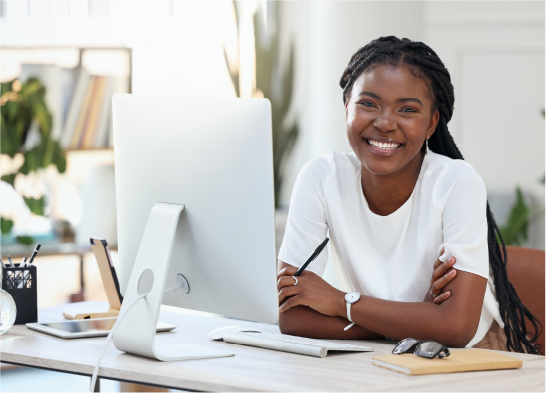 Portrait of black woman in office with computer
