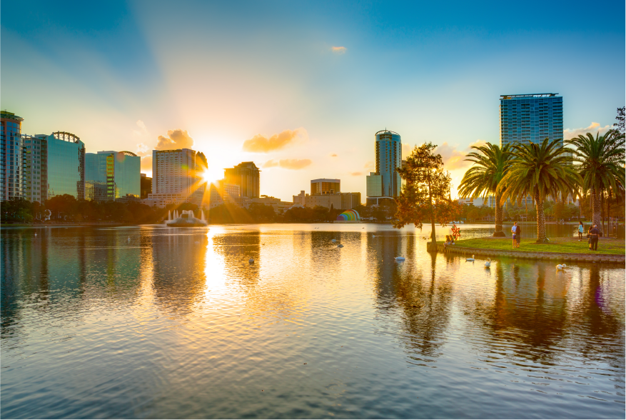 Man front center of a room with people
