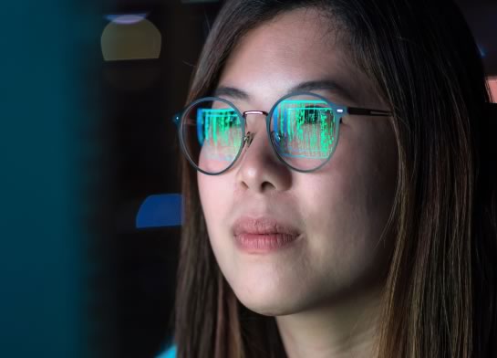 Female face looking towards a screen