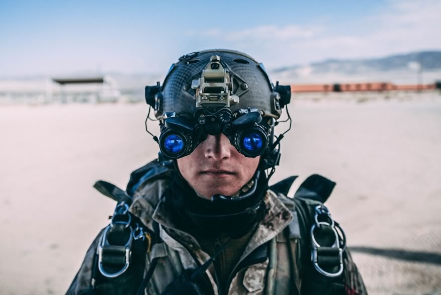 A Marine with 3rd Reconnaissance Battalion, 3rd Marine Division, III Marine Expeditionary Force preforms an operations check on his Binocular Night Vision System M953 at Marine Corps Air Ground Combat Center, Twentynine Palms, Calif., Feb. 13, 2018, as a part of Integrated Training Exercise 2-18. The purpose of ITX is to create a challenging, realistic training environment that produces combat-ready forces capable of operating as an integrated MAGTF. (U.S. Marine Corps Photo by Pfc. William Chockey)