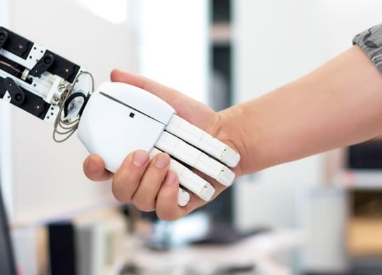 Decorative image of a robot arm handshaking a human hand