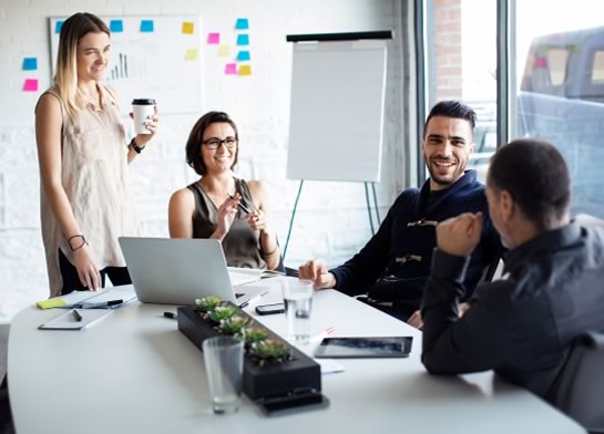 Decorative image of a group of people talking in an office