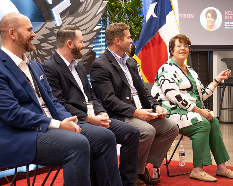 Panelists speak during an event