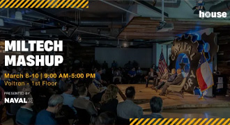 Navy leader discusses tech with business person.