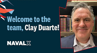 Navy leader discusses tech with business person.